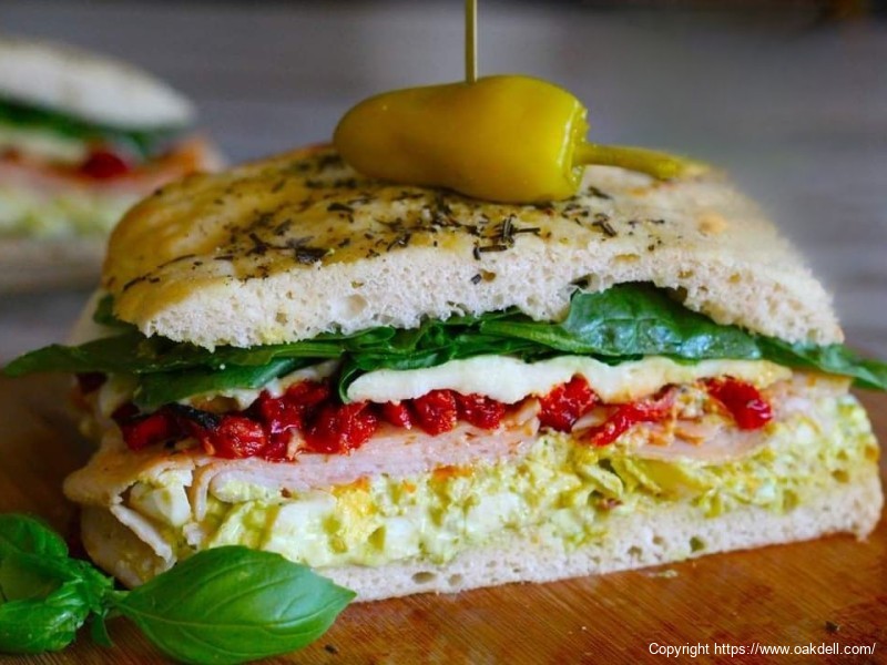 Pesto Egg Salad and Sun - dried Tomato Turkey Sandwich